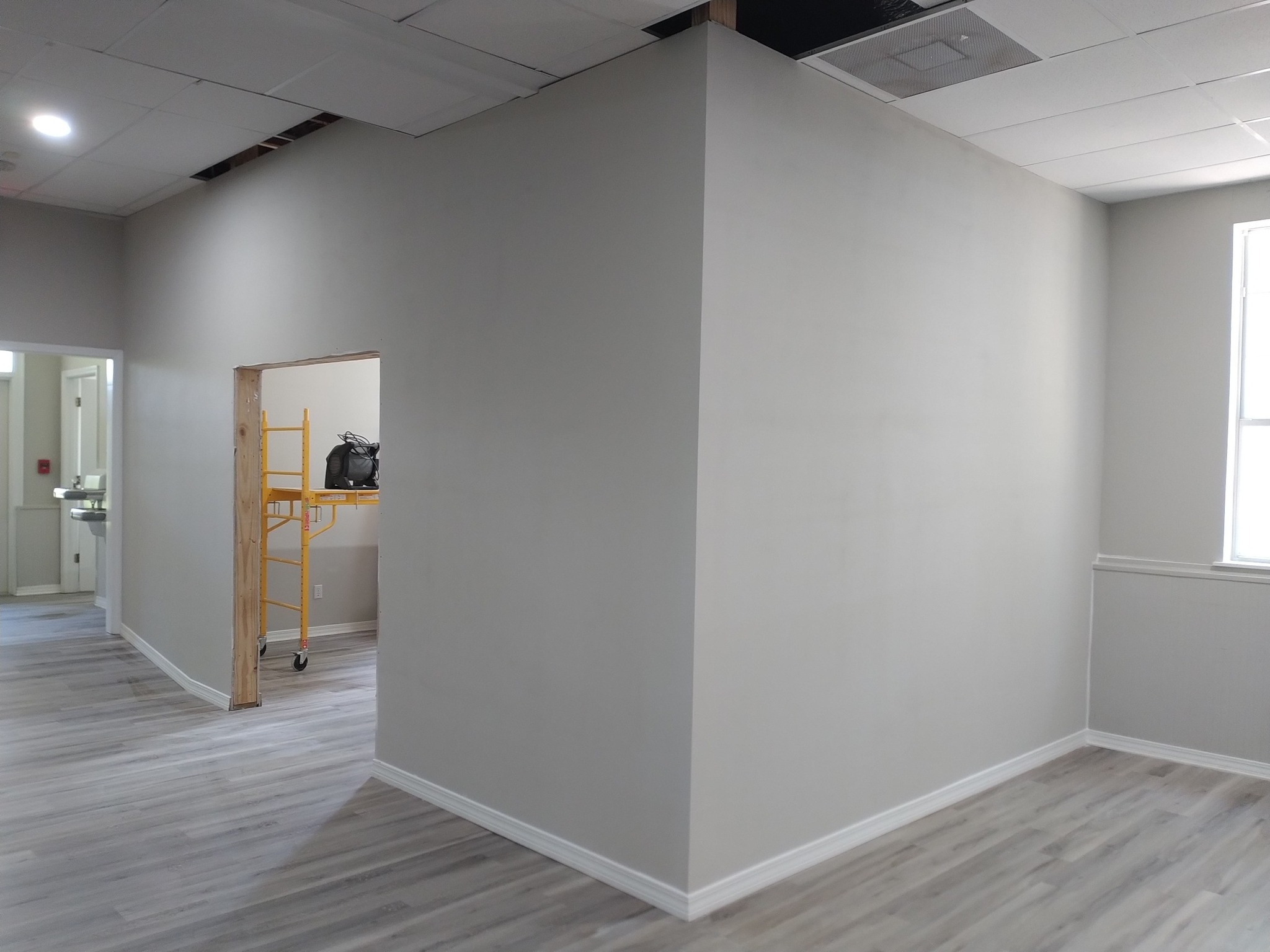 Interior renovation with new wall openings and finish surfaces